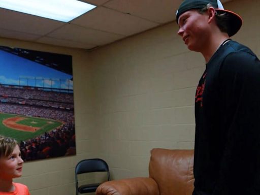 Baltimore Orioles' Jackson Holliday retrieves first home run ball from young fan