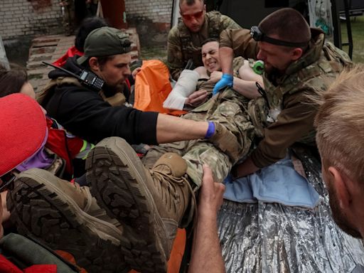 Ukraine reinforces border as thousands flee invading Russians