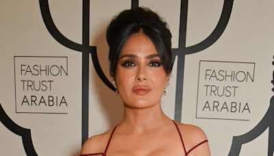 Salma Hayek's curvaceous figure looks phenomenal in extremely tight red dress