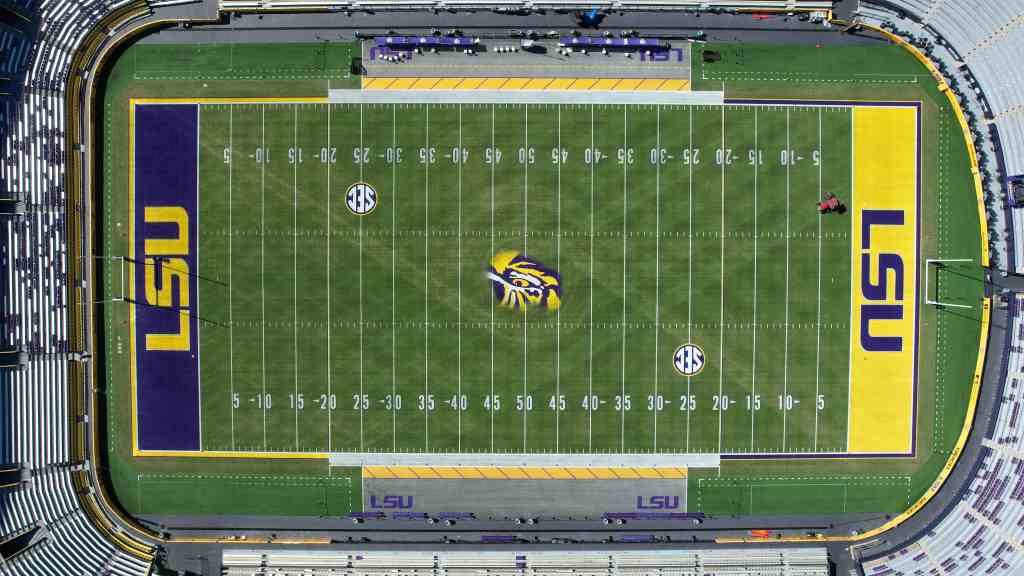 NCAA permits college football teams to add corporate logos on field