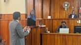 A group of students perform a mock trial while on a trip to Kenya.