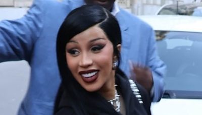 Cardi B covers up her curves in black floaty dress