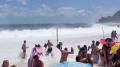 Sunbathers scramble for safety as massive wave hits in viral video