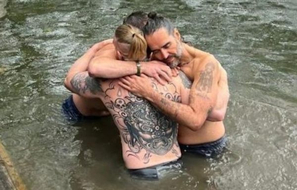 Russell Brand shares new picture embracing Bear Grylls during River Thames baptism