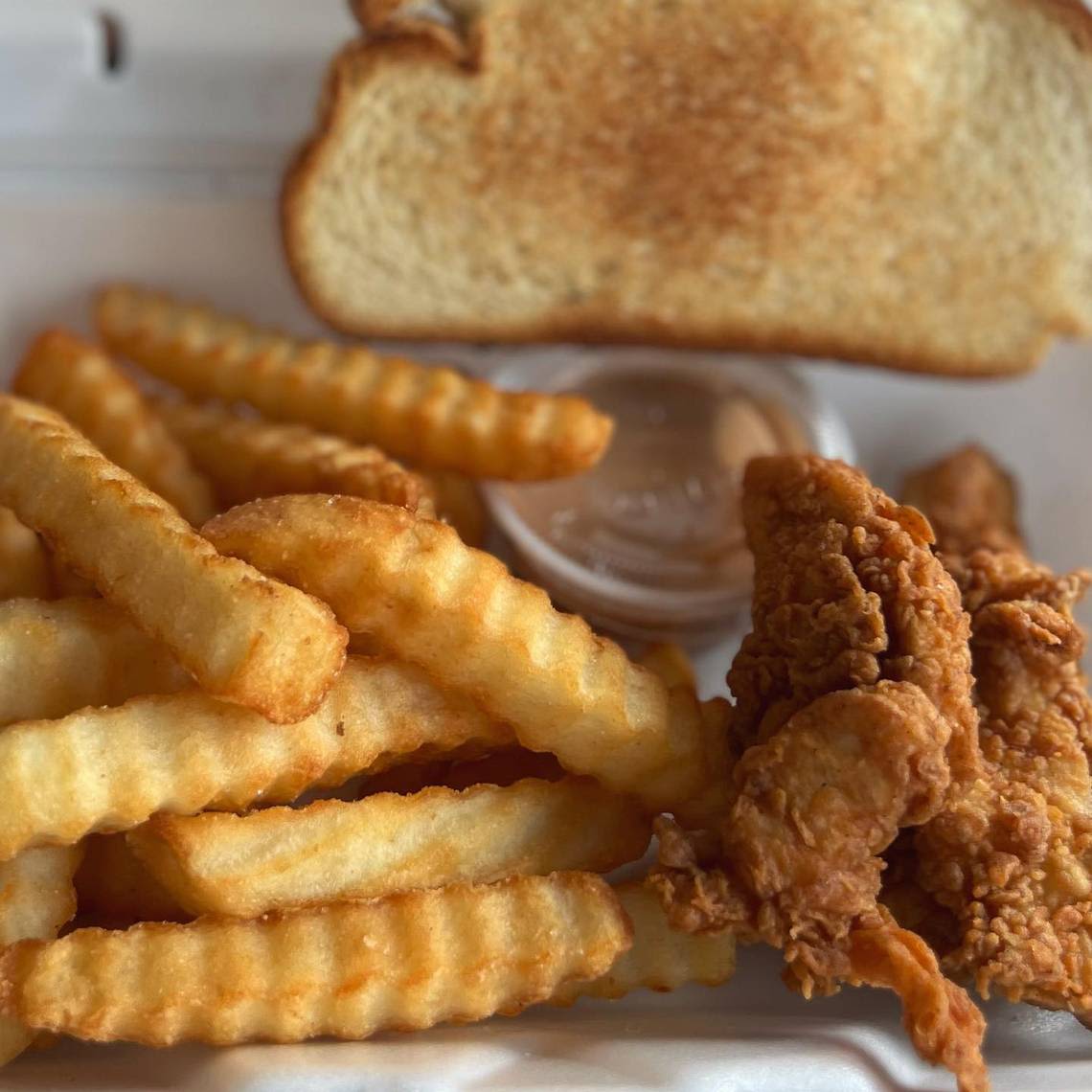 National chain known for chicken fingers eyes location on this bustling Lexington road