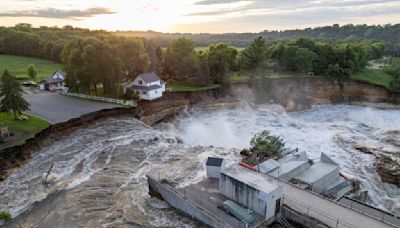 Swollen river claims house next to Minnesota dam as flooding and extreme weather grip the Midwest