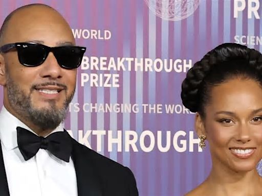 Alicia Keys is on fire in a stunning gold dress alongside husband Swizz Beatz as they joins A-list stars at 10th Annual Breakthrough Prize event in LA