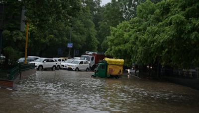 Sudden downpour paralyses Delhi; At least 3 labourers trapped in 'mud slush' as ground caves-in