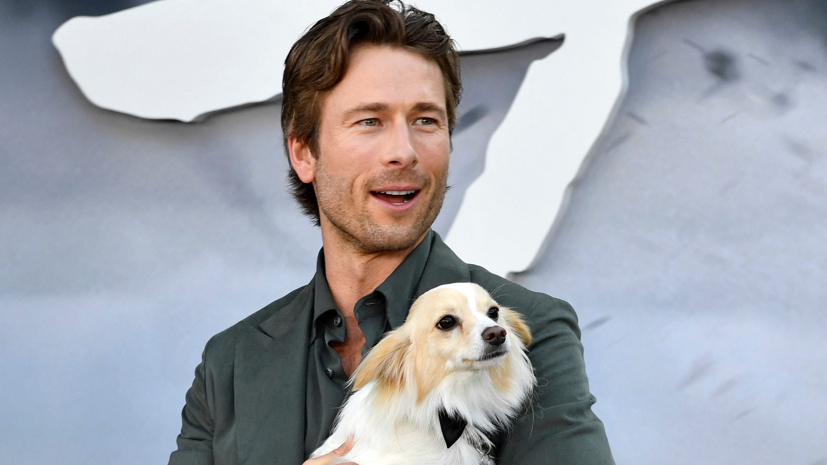 Adopted during the filming of 'Twisters,' Glen Powell's dog Brisket is 'an Oklahoma boy'