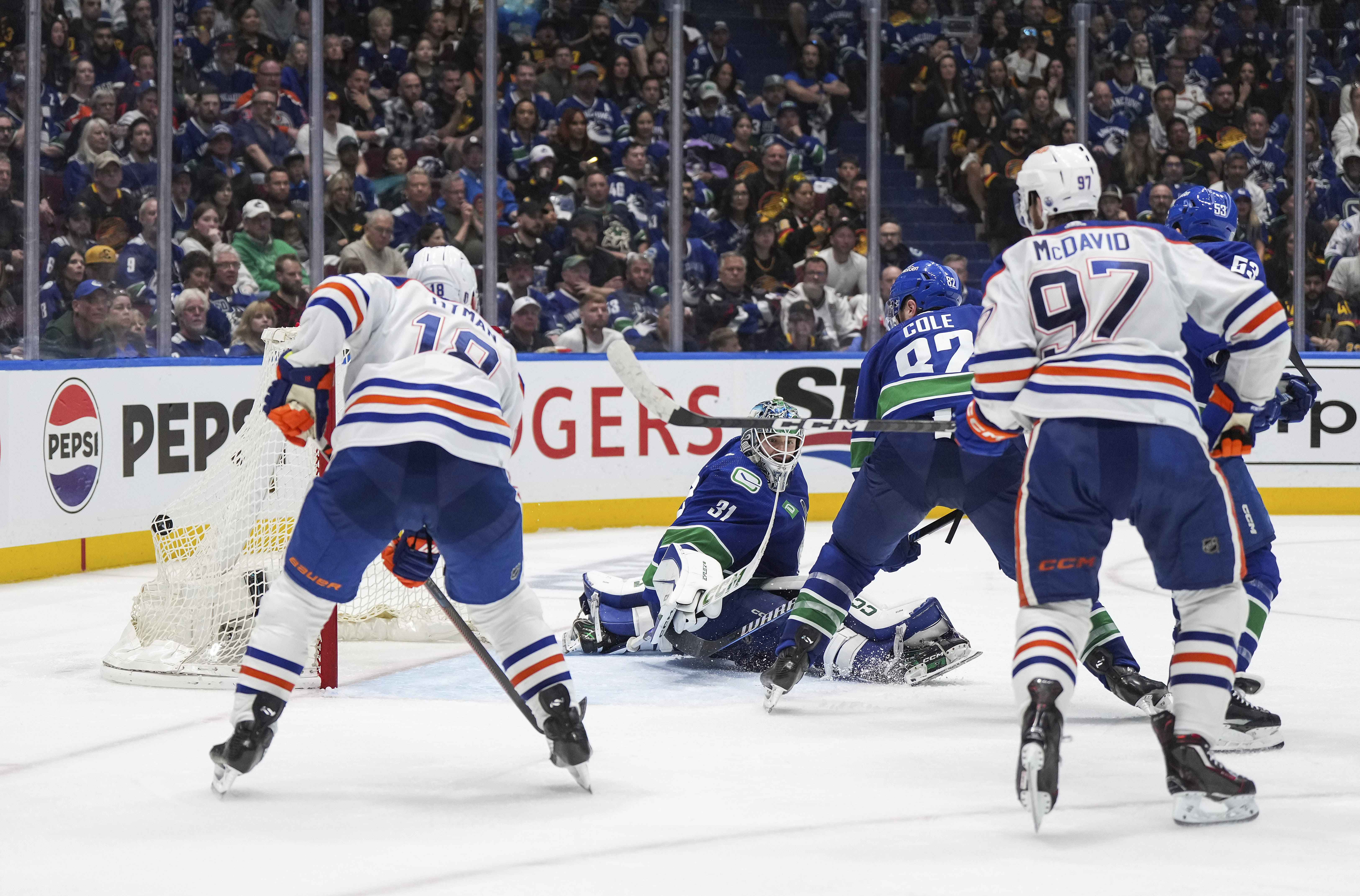 Bouchard scores in OT to lift Oilers to 4-3 win over Canucks in Game 2 to even playoff series