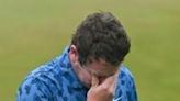 Robert MacIntyre of Scotland wipes away tears after winning the PGA Canadian Open with his father serving as his caddie