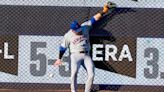 Mets' Bader exits after crashing into outfield wall