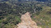 Papua New Guinea's prime minister visits the site of a landslide estimated to have killed hundreds