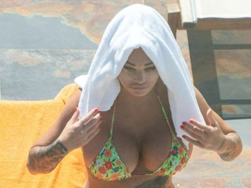 Katie Price spotted on holiday as warrant is out for her arrest in UK