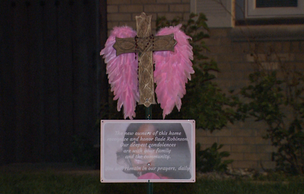 New owners of murder suspect's home place memorial for victim