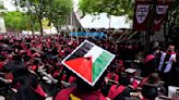 Students walk out of Harvard commencement