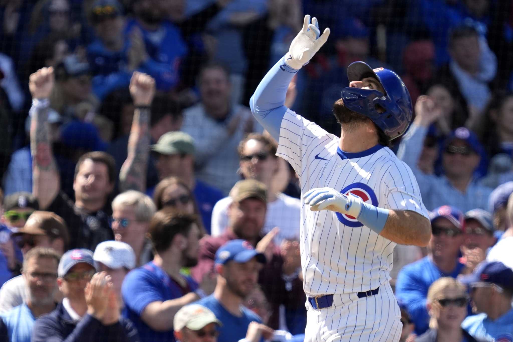 Cubs place SS Dansby Swanson on the injured list with a sprained right knee as OF Suzuki returns