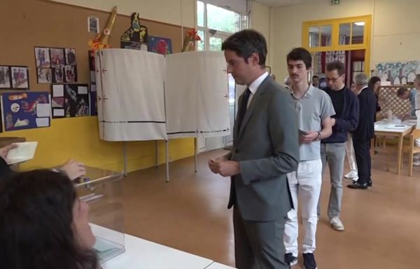 French PM casts vote in pivotal runoff election that could propel far right to power