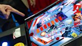 Maga Republicans mocked for playing Jan 6 themed pinball at CPAC