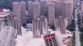 Moment abandoned high rises are DEMOLISHED after builders ‘ran out of cash’