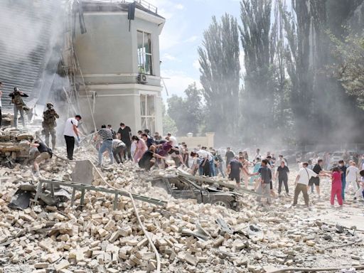 Ukrainian children’s hospital attacked as Russian strikes on cities kill at least 43