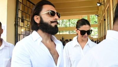 Mom-to-be Deepika Padukone holds Ranveer Singh's hand as they arrive at polling booth to cast votes. Watch