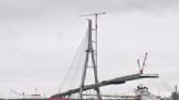 Workers link US, Canadian sides of new Gordie Howe International Bridge over Detroit River