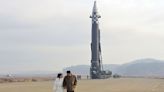 North Korea unveils Kim's daughter at missile launch site