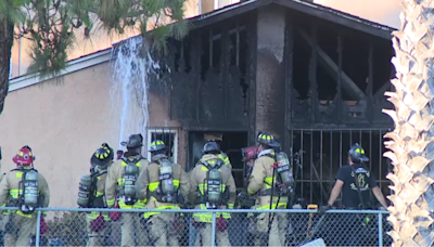 Elderly woman rescued from house fire; neighbor displaced