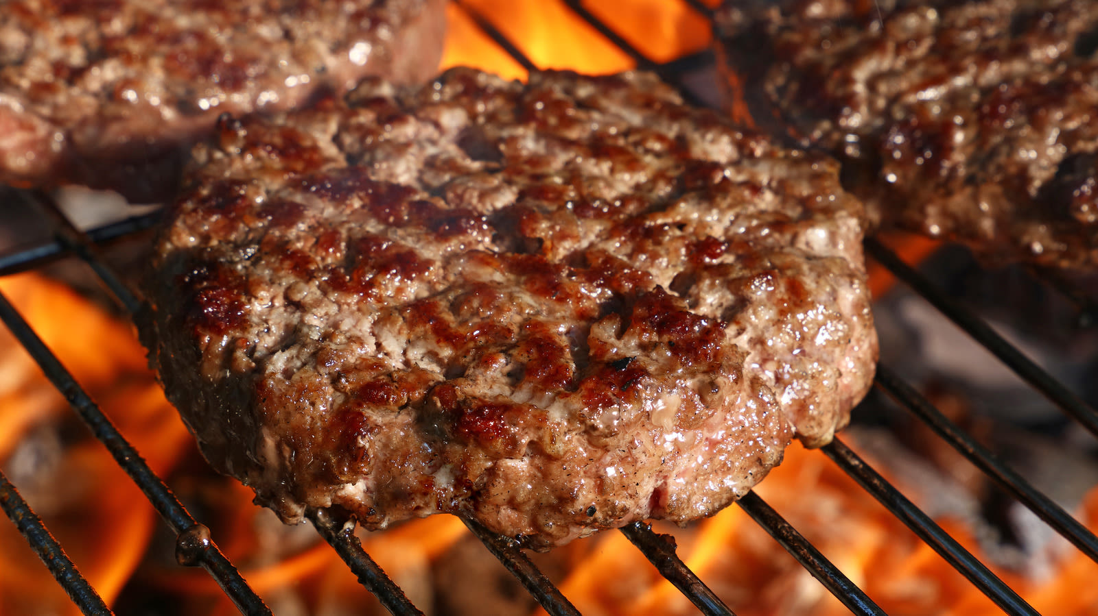 The Hack For Perfectly Moist Grilled Burgers Is Hidden In Your Freezer