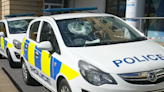 Arrest after police cars smashed outside station