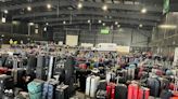Photo shows the huge sea of lost luggage that built up at Edinburgh Airport amid travel chaos