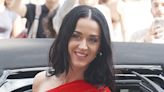 Katy Perry turns heads in a red minidress and huge train in Paris