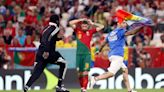World Cup protestor waving rainbow flag interrupts Portugal vs. Uruguay match