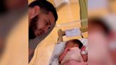 Watch this young dad tear up with pride while dressing his newborn baby girl