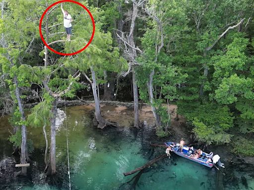 Heart-stopping moment man falls 60ft into creek