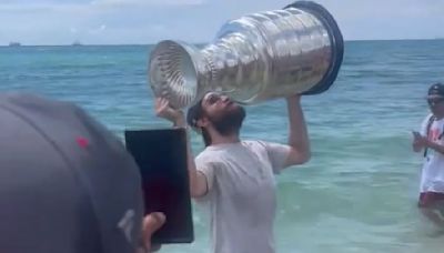 Panthers' Matthew Tkachuk takes a dip in the ocean with Stanley Cup