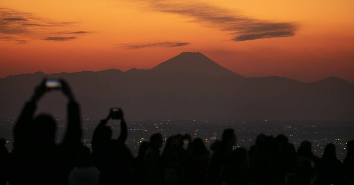 Japan, famously polite, struggles to cope with influx of tourists