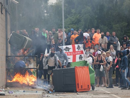 UK riots live: Belfast man in serious condition after suspected hate crime as police attacked in Plymouth