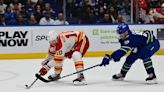 Nils Hoglander scores twice as Canucks top Flames