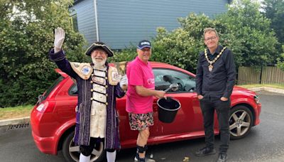 Care home staff and deputy mayor hold charity car wash