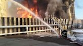 Russian firefighters tackle oil depot blaze following alleged drone attack