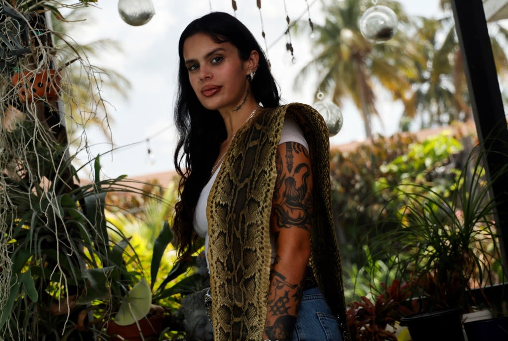 Designer catches invasive pythons and transforms them into fashion