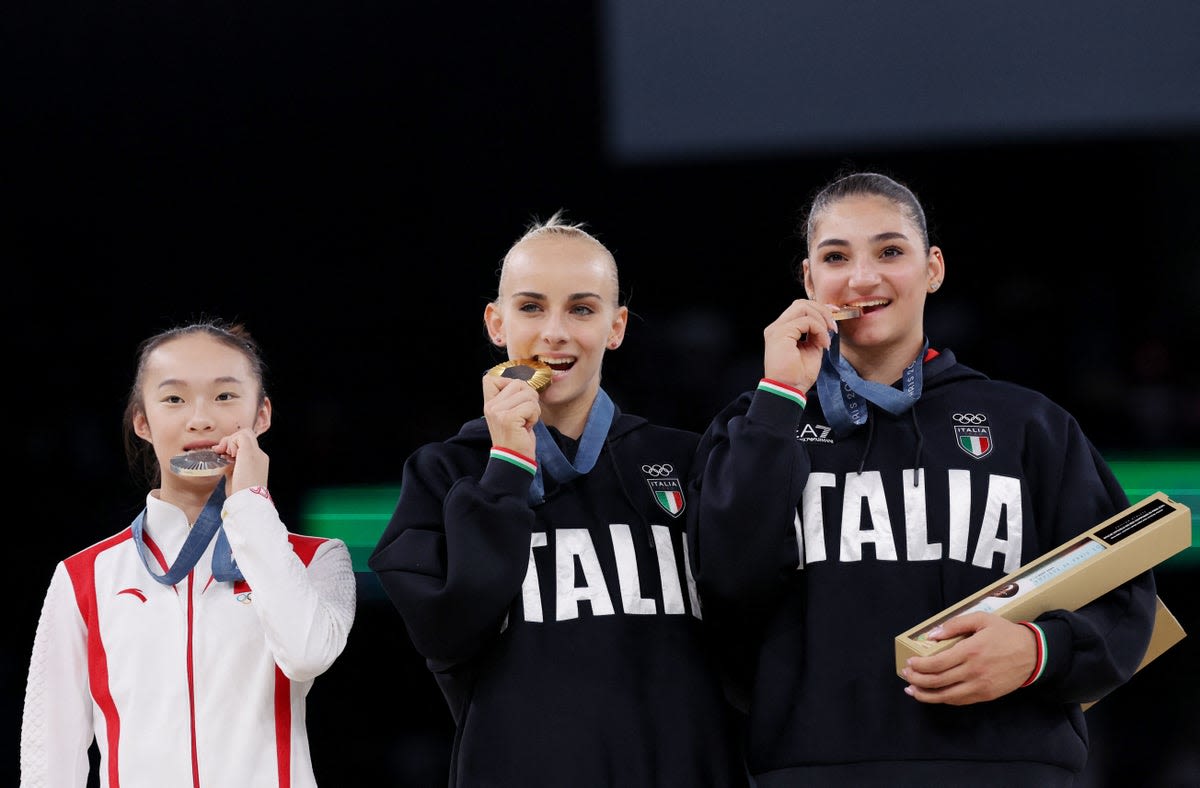 Chinese gymnast’s ‘relatable’ reaction to competitors biting medals on Olympic podium goes viral