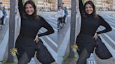 Kajal Aggarwal is a stylish birthday girl in an all-black outfit ft turtleneck top and mini skirt complemented by stockings