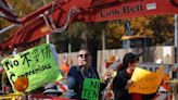 Protesters scuffle with police ahead of community meeting over tent city for migrants in Chicago park, one taken to hospital