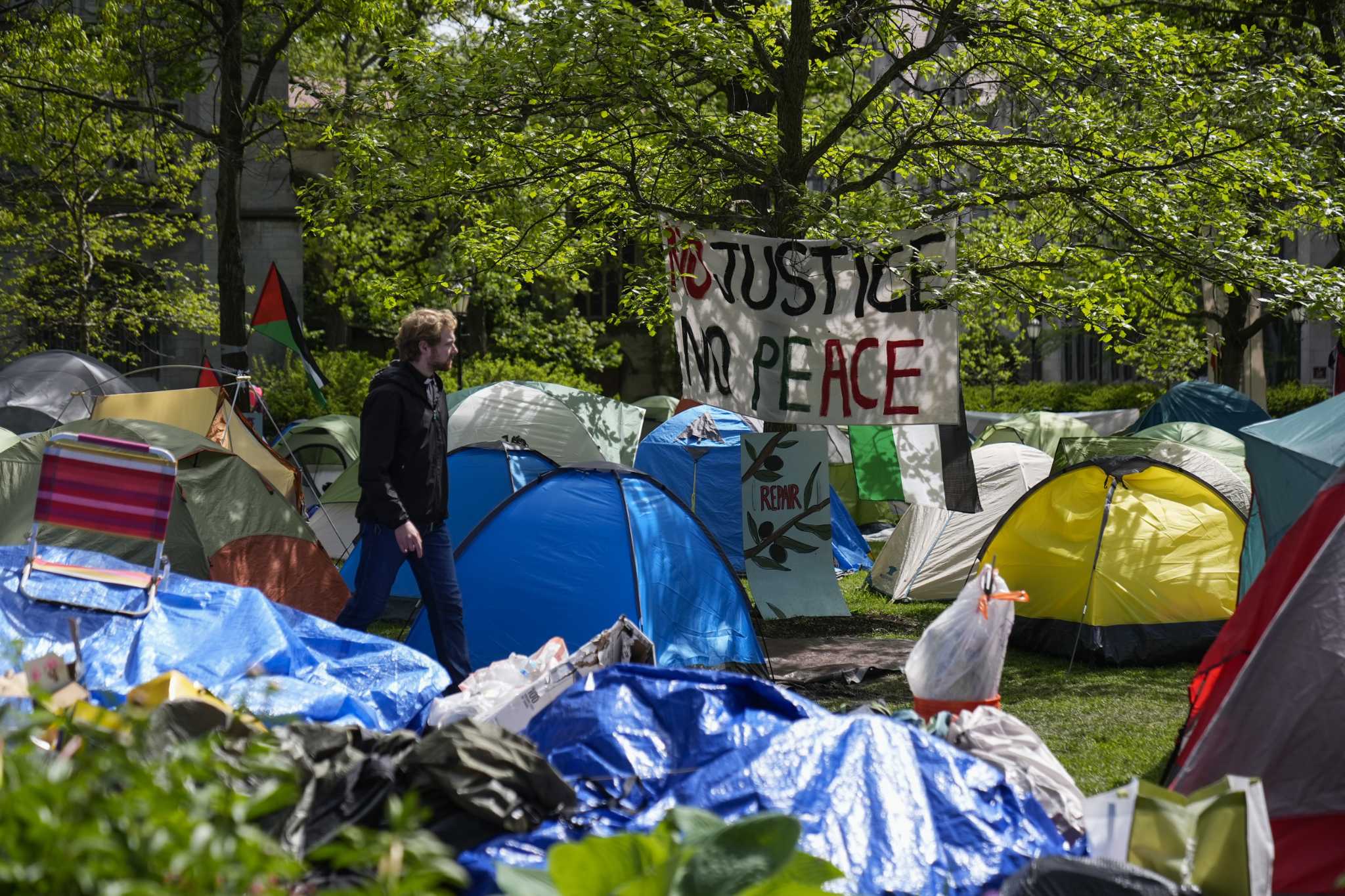 Striking deals to end campus protests, some colleges invite discussion of their investments