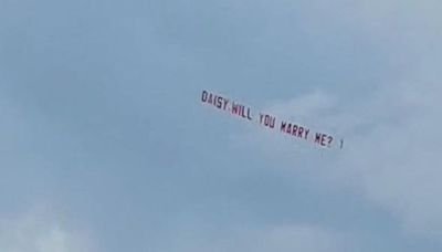 Love is in the air during aerial proposal