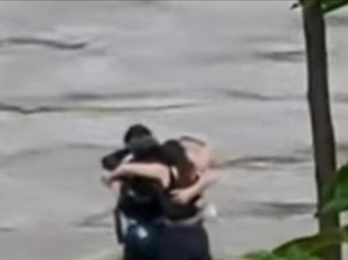 Three friends seen hugging before being swept away by floodwaters in Italy