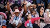 Large parade crowd helps kick off first day of the Calgary Stampede | CBC News